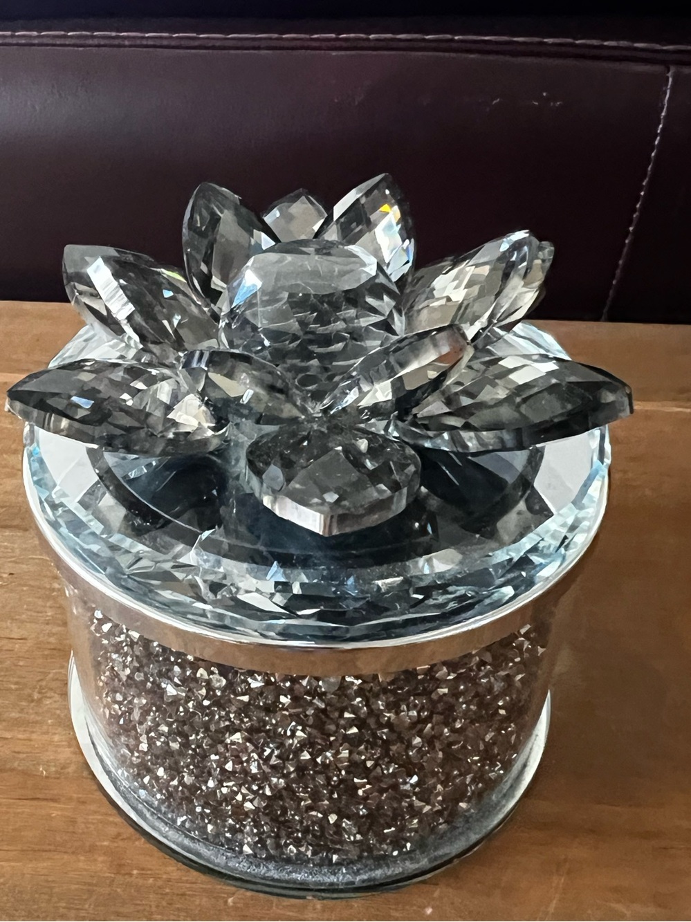 This is a Sagebrook Home Smoke Black Crystal Round Lotus Box. 4” diameter.